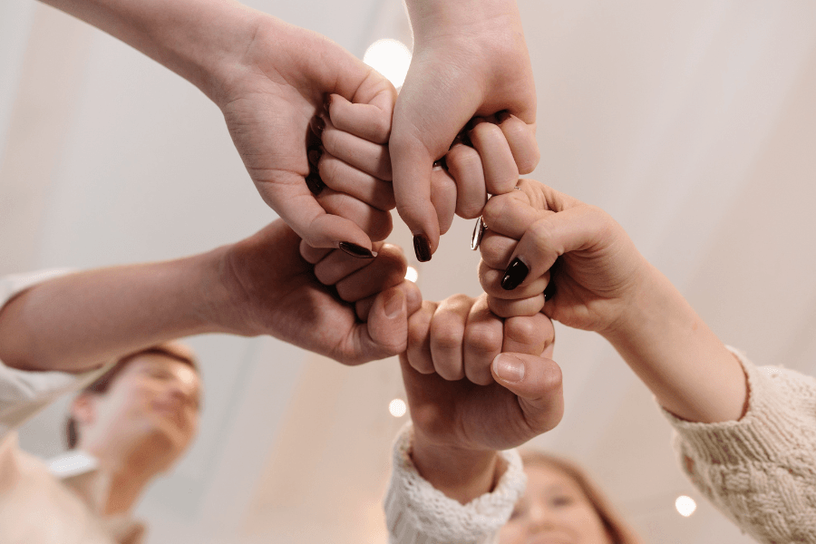 circle of fists showing solidarity