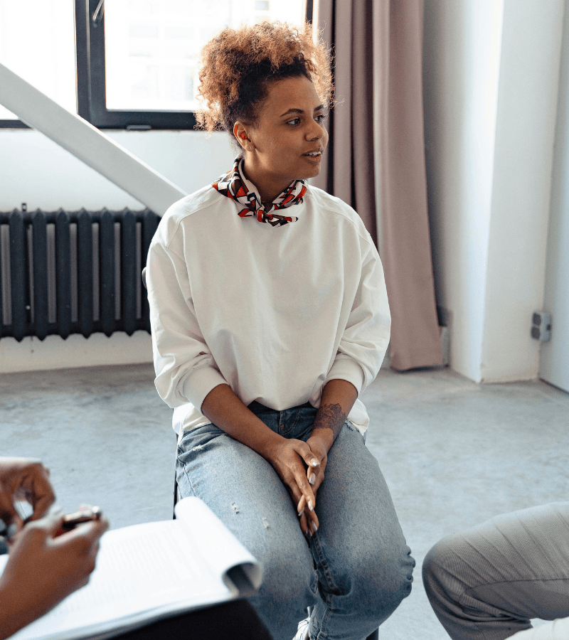 woman participating in a treatment center support group